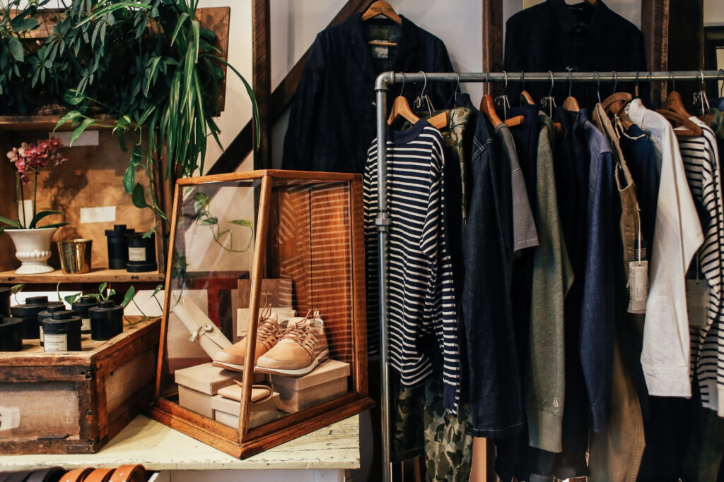Inside an independent specialty retail shop with clothing racks and product displays, the kind of small business competing for customers during Prime Day