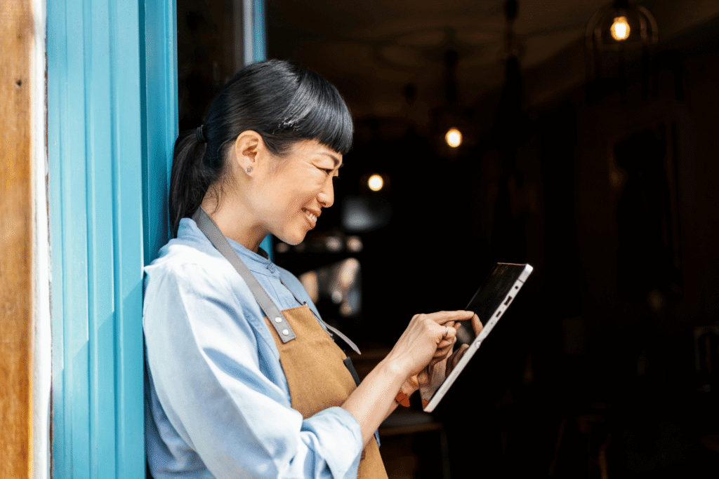 What Comes After Payments? The Next Phase of Embedded Finance: A Q&A 2 Small business owner accepting a payment on a tablet through her software platform's embedded payment tools